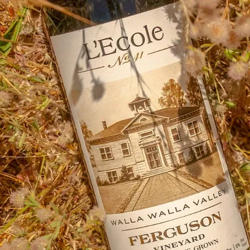 A magazine cover reading “Ferguson” and “Walla Walla Valley” lies in grassy straw.